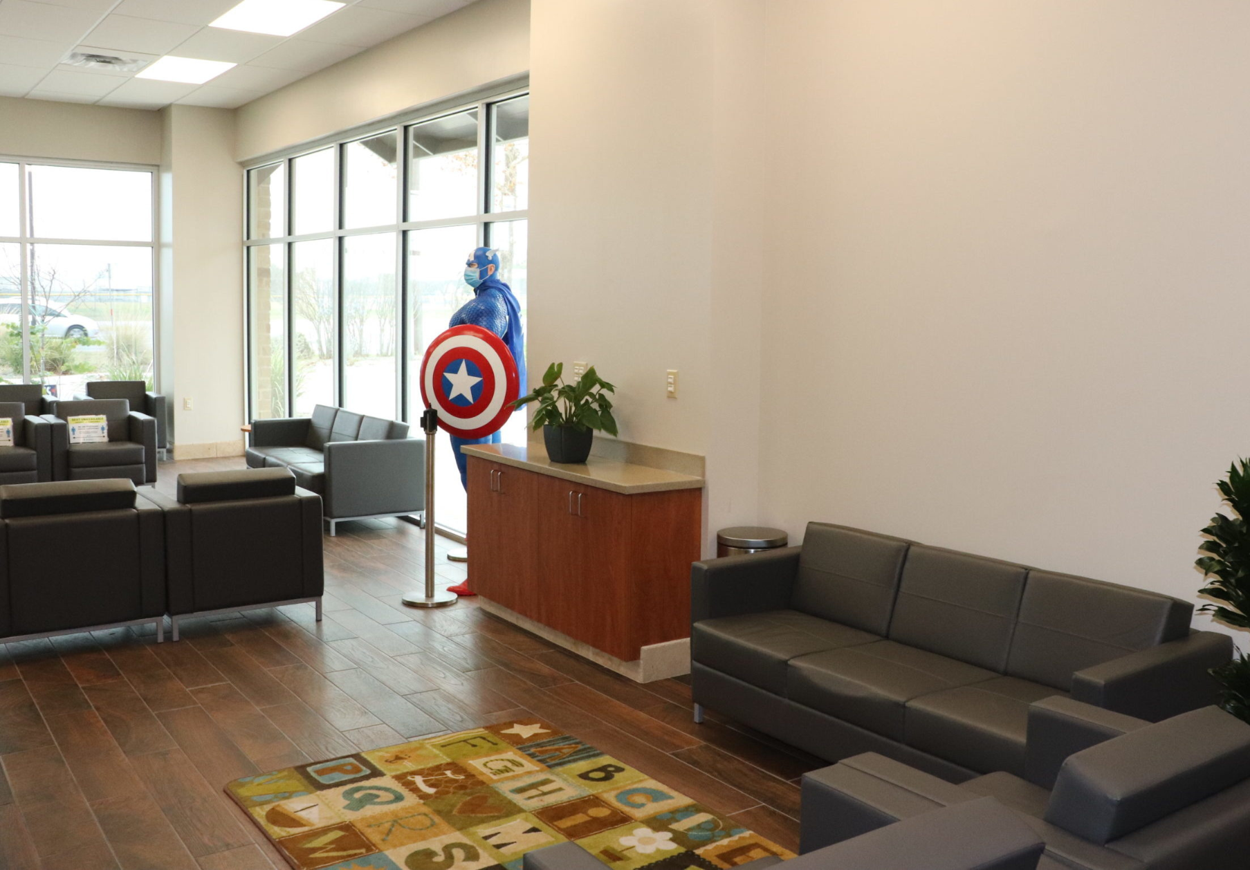 Helotes Campus Clinic Waiting Room with Captain America Statue